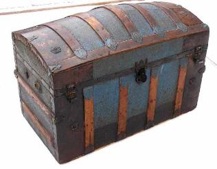 A beautiful dome top trunk with casted locks, and a beautiful geometric tin pattern, great ornamentation